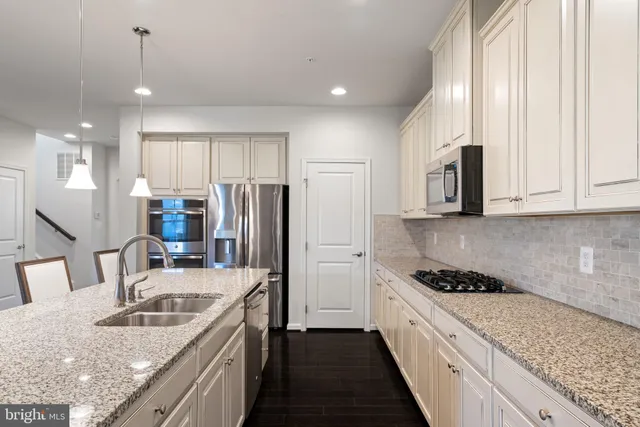 a living room with furniture a table and a fireplace