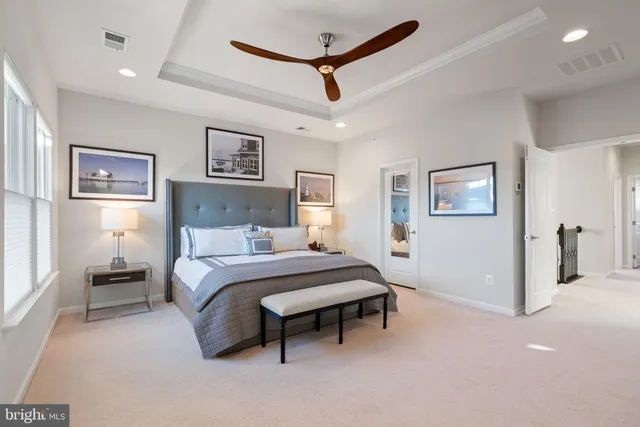 a bedroom with a bed and a lamp