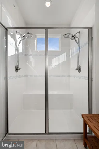 a bedroom with a bed couch and window