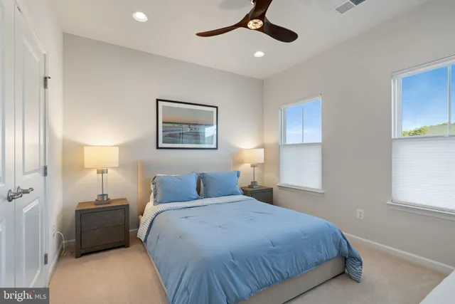 a living room with furniture a couch and a flat screen tv