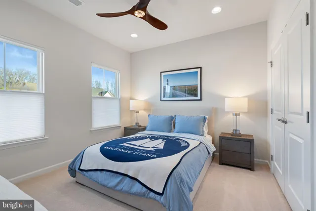 a kitchen with stainless steel appliances granite countertop a stove a refrigerator a oven a sink with a dining table and chairs