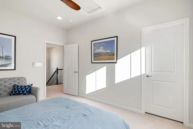 a view of a patio with table and chairs with wooden floor and fence
