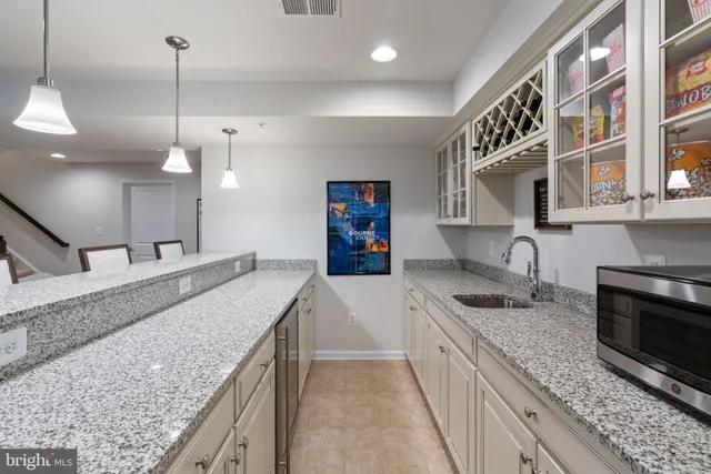 a sign that is sitting in front of flowers