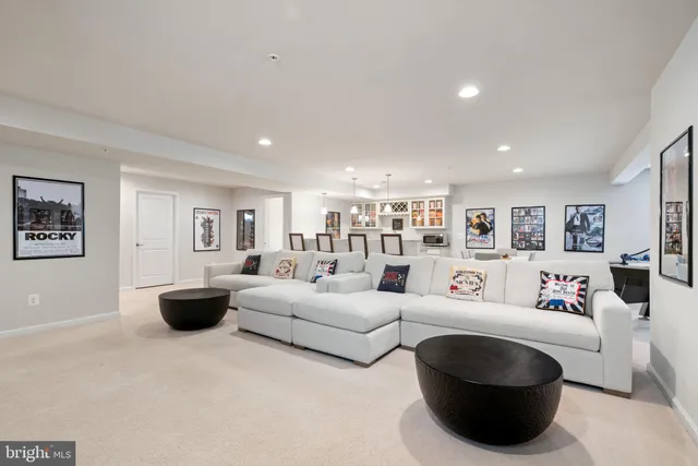 a kitchen with a stove a table and chairs in it
