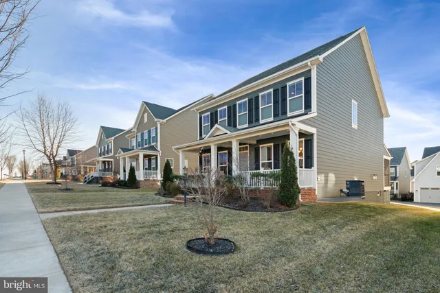 a view of a room with a window and wooden floor