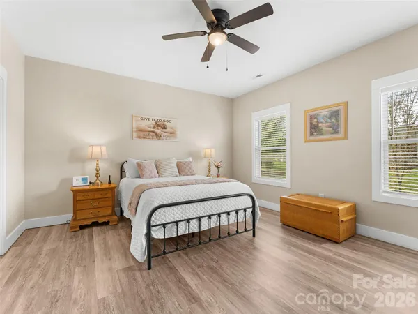 a spacious bedroom with a bed and a couch