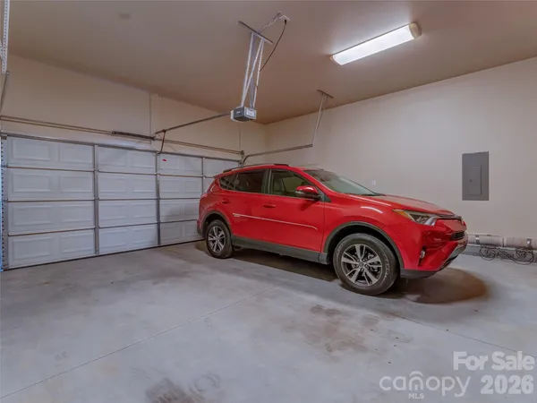 a view of a garage and car parked