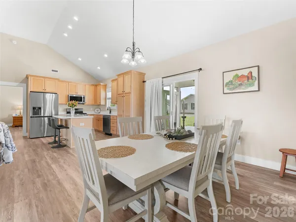 a view of a dining room kitchen and a table