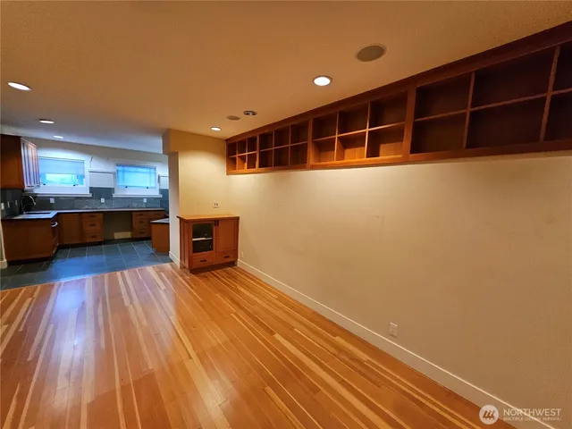 a view of a living room with wooden floor