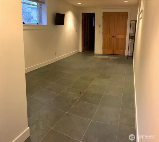 a view of an empty room with closet