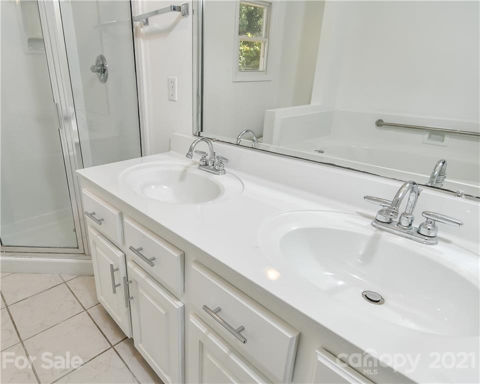 1215 Summerville Road Charlotte, NC 28214 - Photo 16 of 25 a bathroom with a sink and a mirror