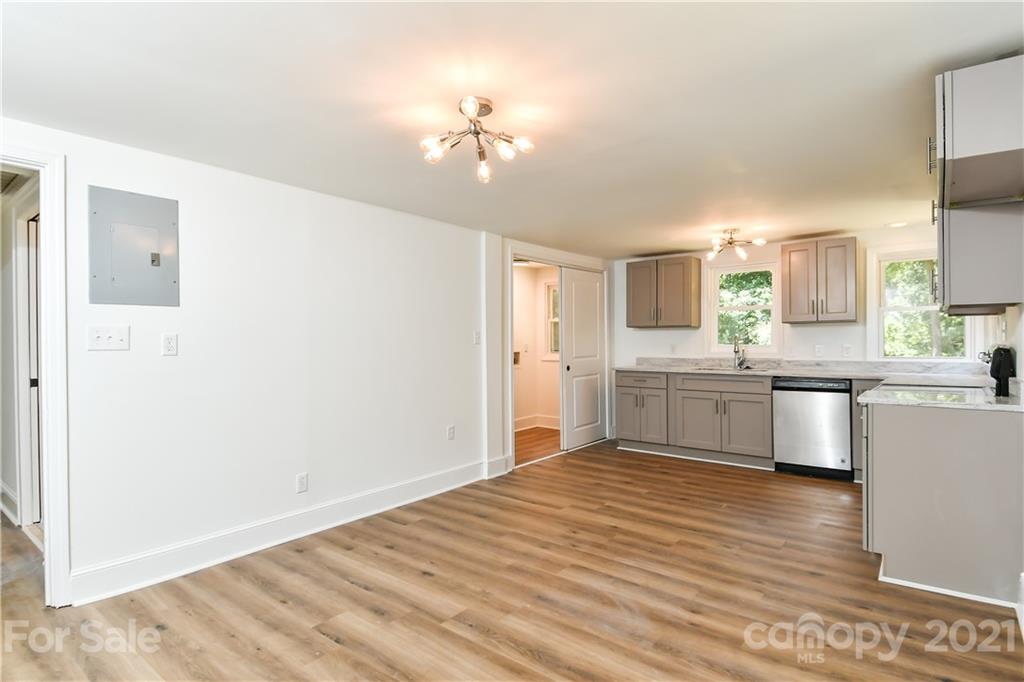 1215 Summerville Road Charlotte, NC 28214 - Photo 17 of 25 a kitchen with a refrigerator sink and cabinets