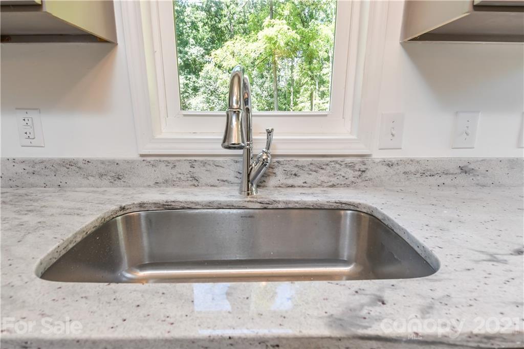 1215 Summerville Road Charlotte, NC 28214 - Photo 20 of 25 a close view of sink and tap