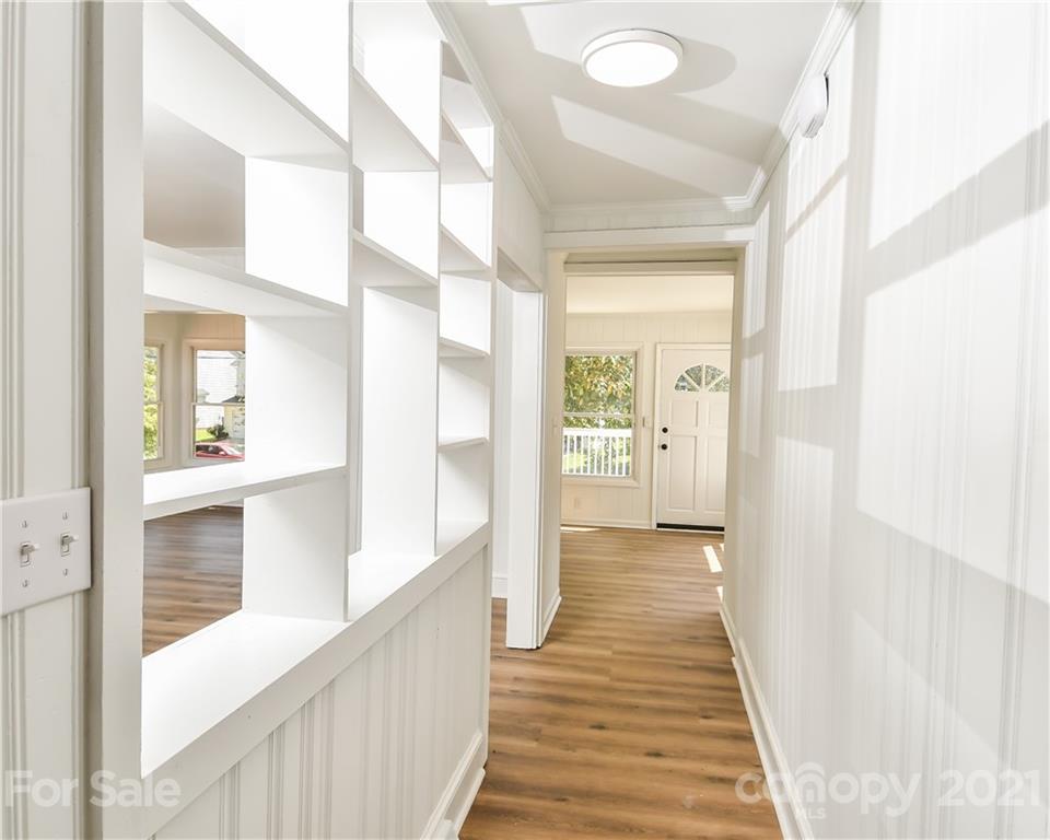 1215 Summerville Road Charlotte, NC 28214 - Photo 25 of 25 a view of a hallway with wooden floor and staircase
