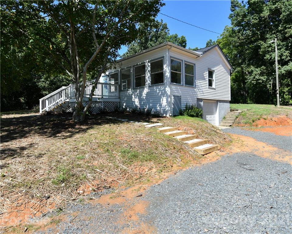1215 Summerville Road Charlotte, NC 28214 - Photo 4 of 25 a front view of a house with a yard