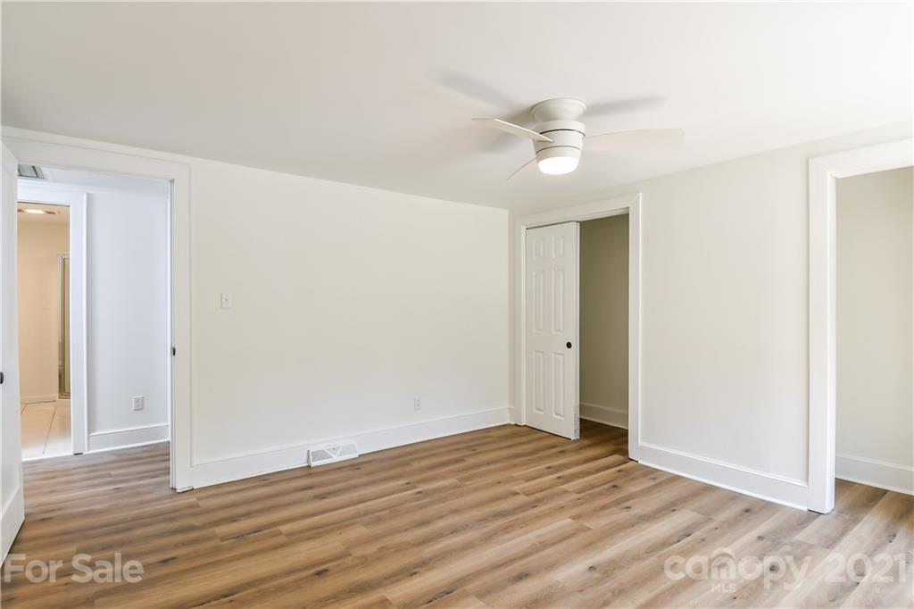 1215 Summerville Road Charlotte, NC 28214 - Photo 10 of 25 a view of an empty room with wooden floor