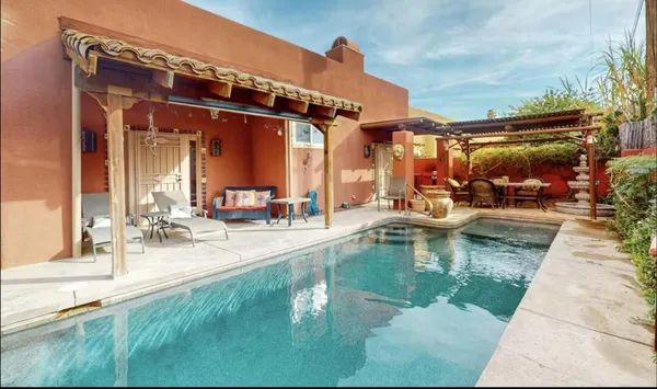 a view of a swimming pool with a patio