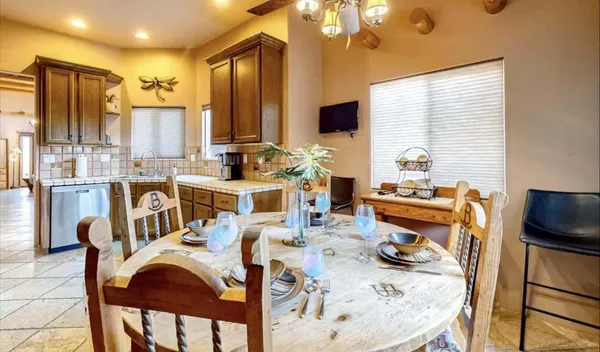 a view of a dining room with furniture window and outside view