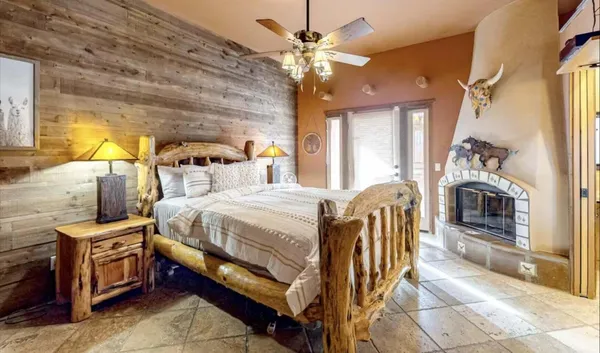 a bed room with a bed and a chandelier