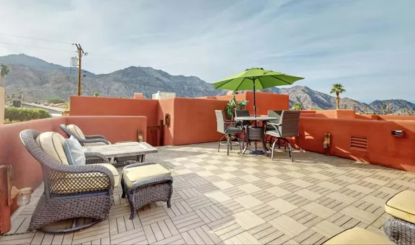 a outdoor space with patio the couches and dining table with swimming pool