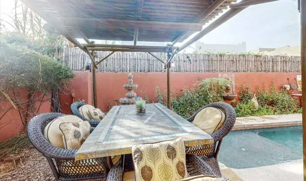 a outdoor dining space with furniture and a garden