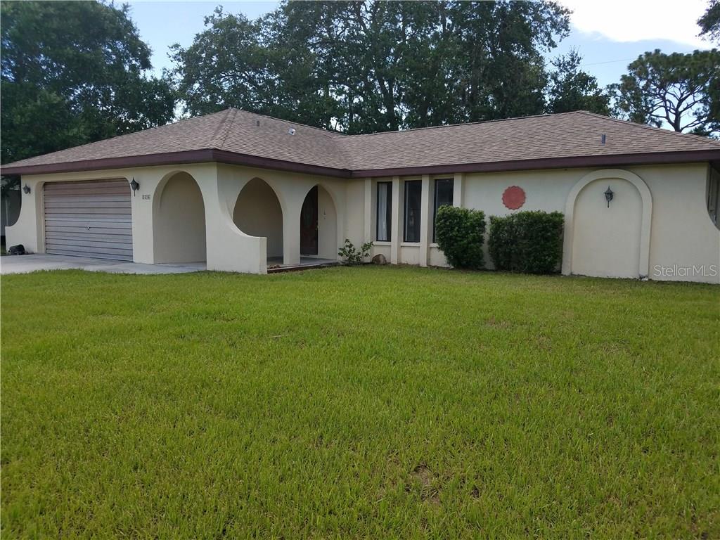 224 Marlin Road Venice, FL 34293 - Photo 1 of 1 a front view of house with yard and garage