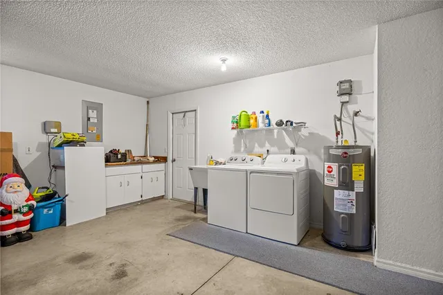 an aerial view of a house with a yard basket ball court and outdoor seating