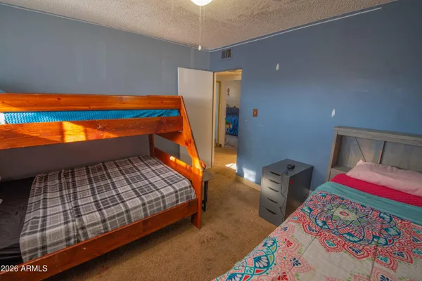 a bedroom with bed and window