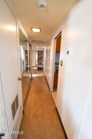 a living room with furniture and flowers