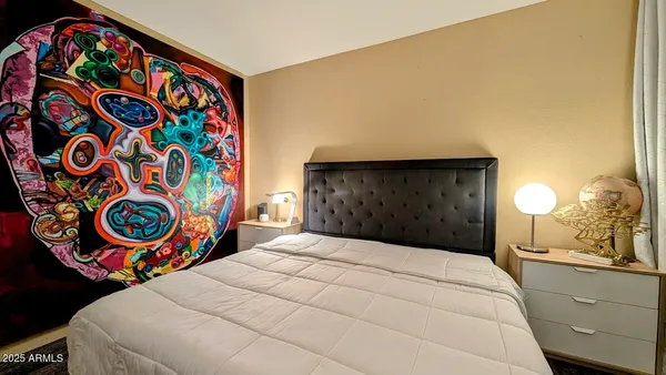 a bedroom with a bed and a window