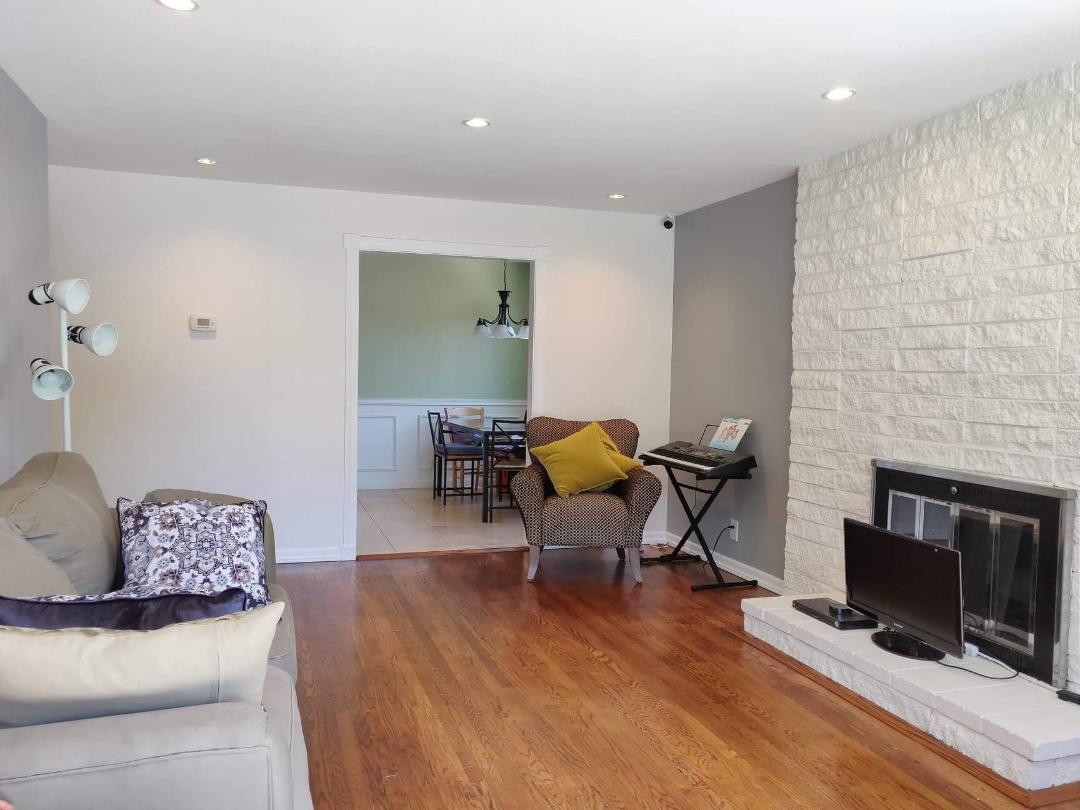 1482 Fields Drive San Jose, CA 95129 - Photo 2 of 15 a living room with furniture a flat screen tv and a fireplace