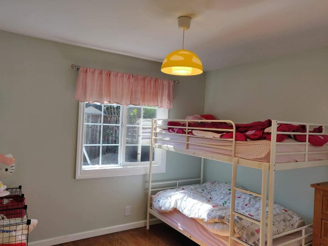 1482 Fields Drive San Jose, CA 95129 - Photo 7 of 15 a bedroom with a bed and a window
