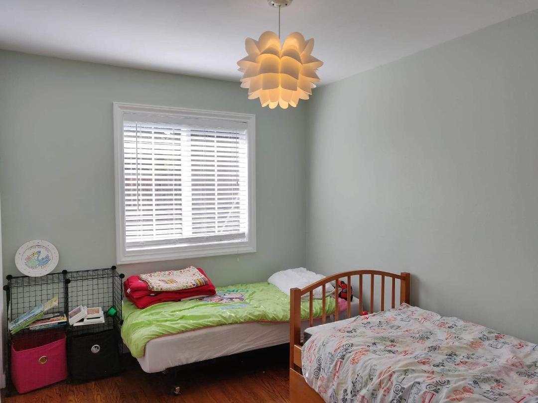 1482 Fields Drive San Jose, CA 95129 - Photo 8 of 15 a bedroom with two beds and a chandelier