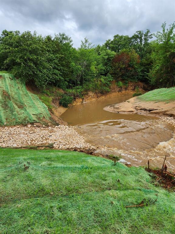 2212 Spring Hill Road Aubrey, TX 76227 - Photo 21 of 36 a view of a lake with outdoor space