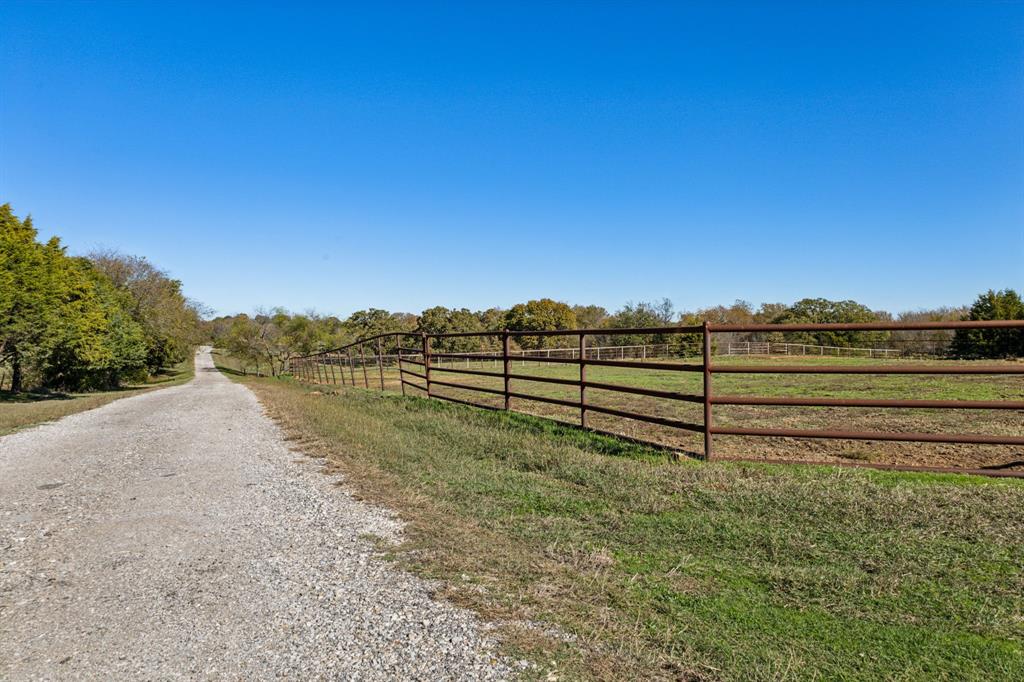 2212 Spring Hill Road Aubrey, TX 76227 - Photo 32 of 36 a view of a yard with an outdoor space