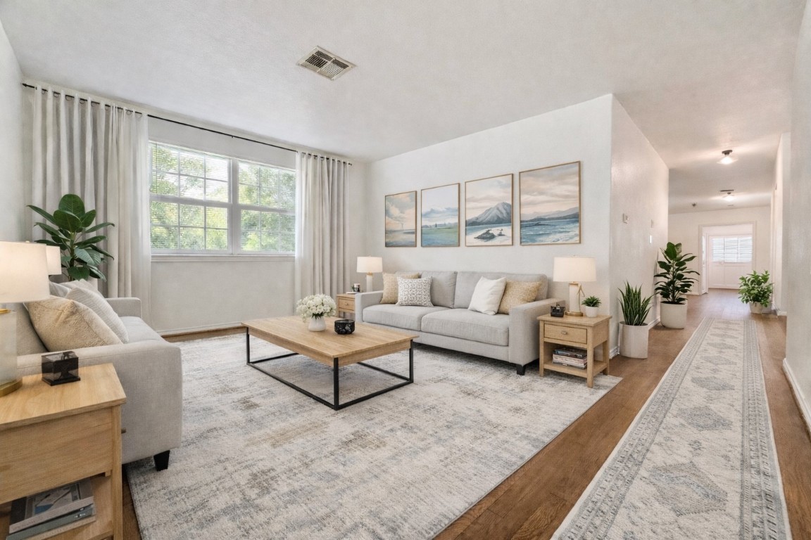 2126 Banks Street, Unit 3 Houston, TX 77098 - Photo 11 of 41 a living room with furniture and a large window