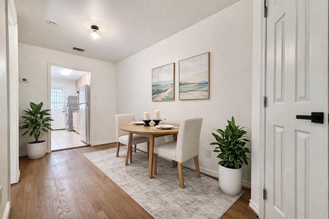 2126 Banks Street, Unit 3 Houston, TX 77098 - Photo 17 of 41 a view of a workspace room with wooden floor and a potted plant