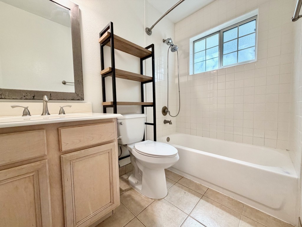 2126 Banks Street, Unit 3 Houston, TX 77098 - Photo 24 of 41 a bathroom with a sink toilet and shower