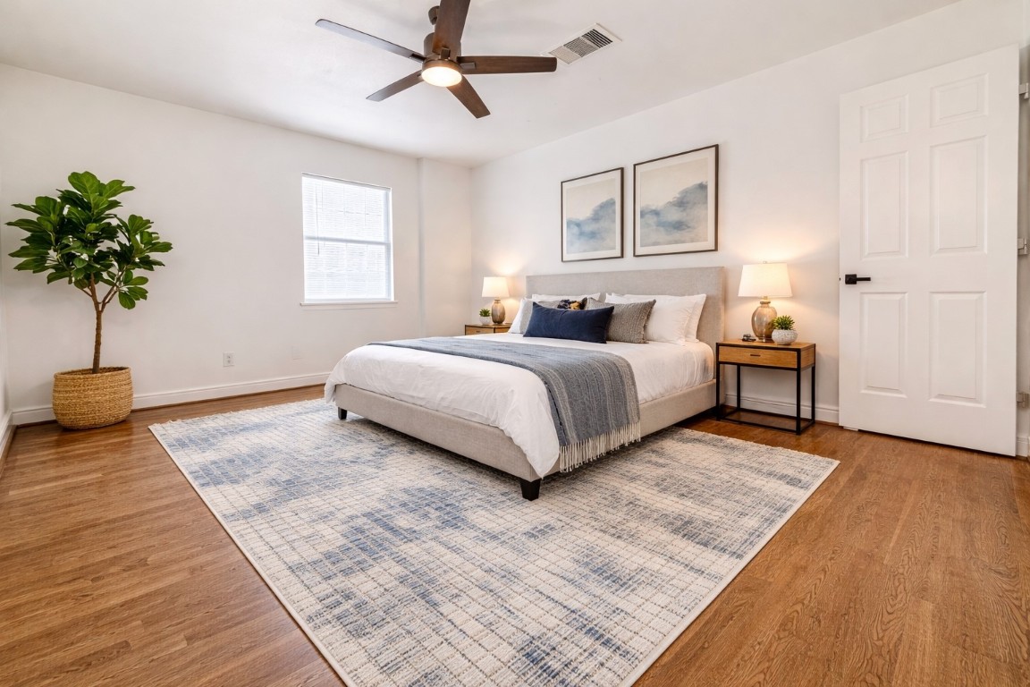 2126 Banks Street, Unit 3 Houston, TX 77098 - Photo 27 of 41 a bedroom with a bed and a potted plant