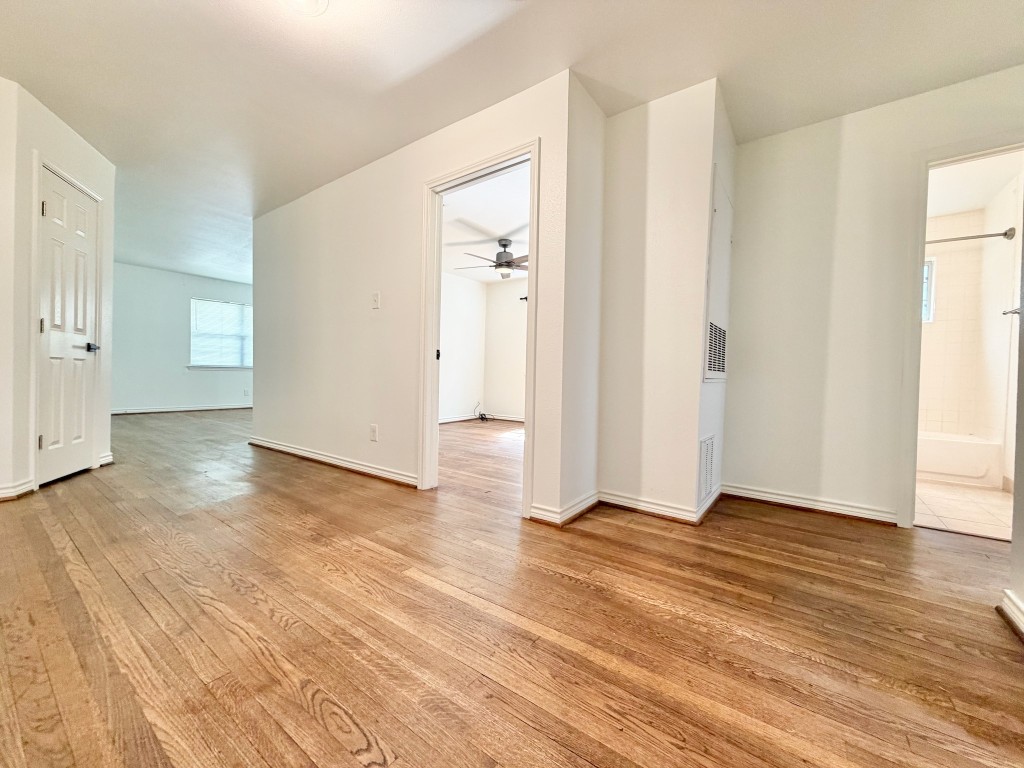 2126 Banks Street, Unit 3 Houston, TX 77098 - Photo 30 of 41 a view of an empty room with wooden floor and a window