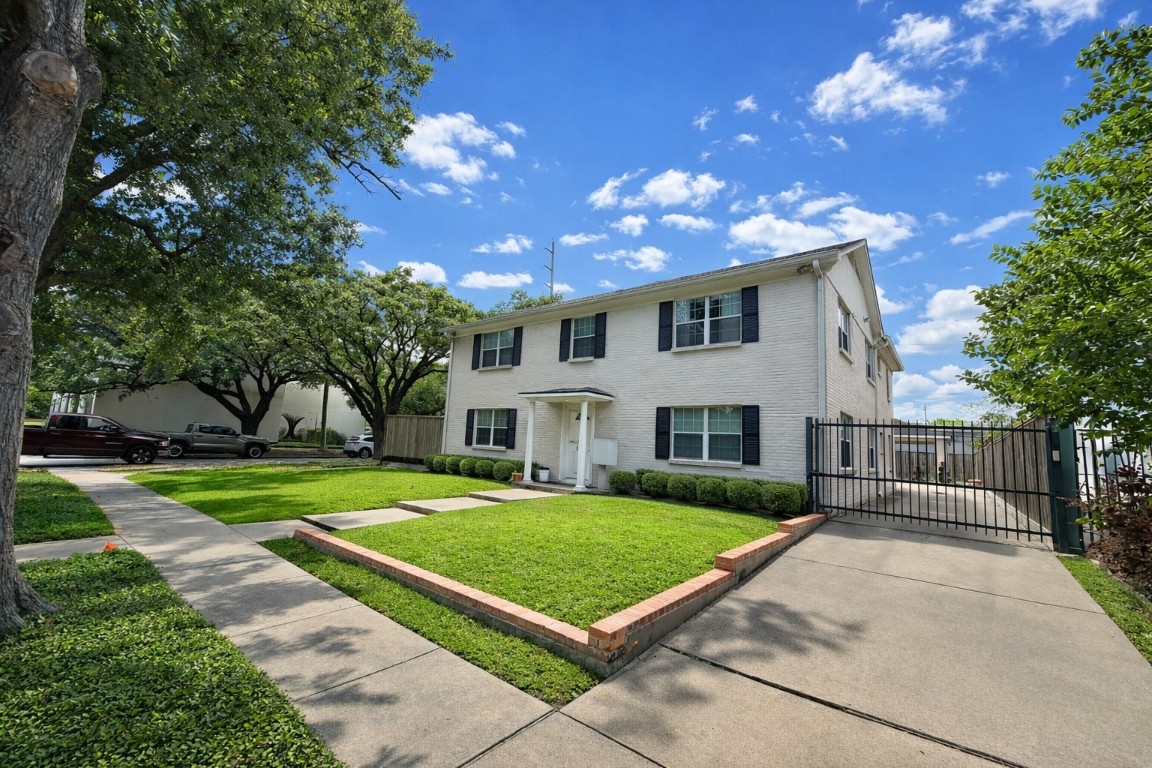 2126 Banks Street, Unit 3 Houston, TX 77098 - Photo 3 of 41 a front view of a house with a yard