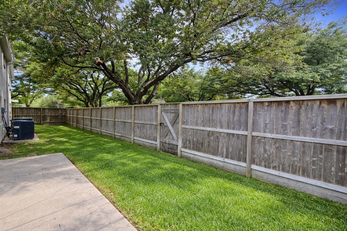 2126 Banks Street, Unit 3 Houston, TX 77098 - Photo 36 of 41 a view of a yard with a wooden fence