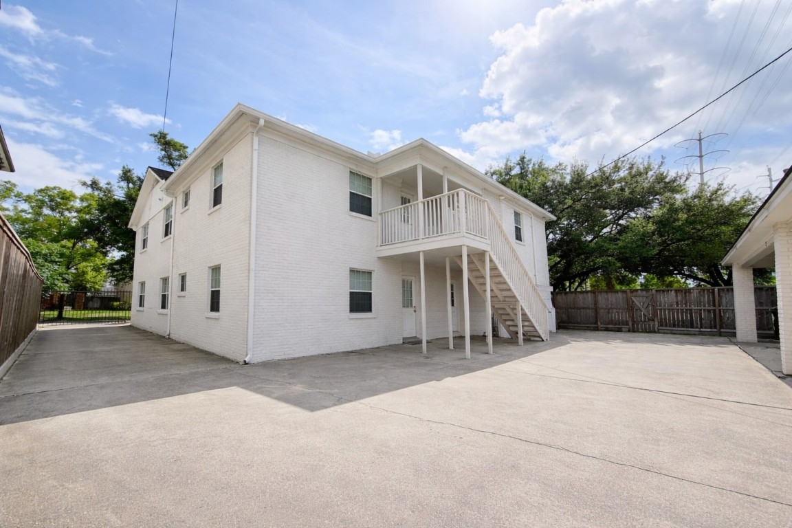 2126 Banks Street, Unit 3 Houston, TX 77098 - Photo 37 of 41 a view of a white house with a yard and garage