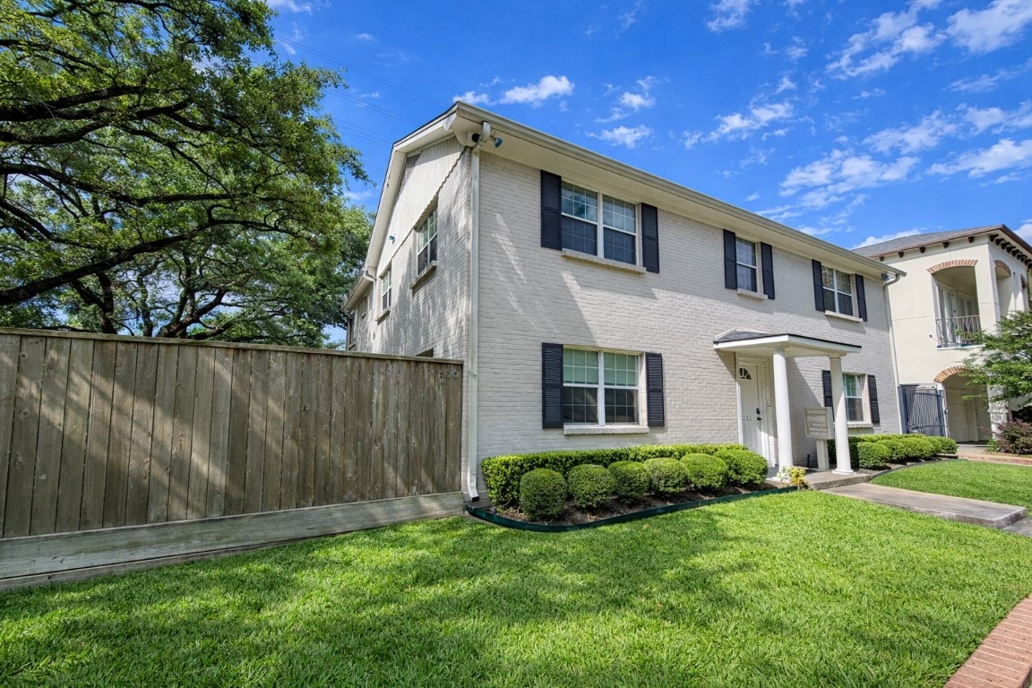 2126 Banks Street, Unit 3 Houston, TX 77098 - Photo 6 of 41 a front view of a house with a yard