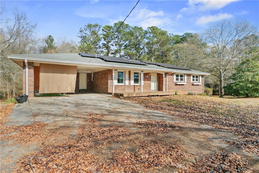 3758 Sharon Drive Powder Springs, GA 30127 - Photo 1 of 1 front view of a house with a yard
