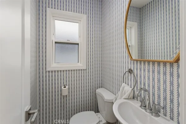 a bathroom with a toilet and a sink