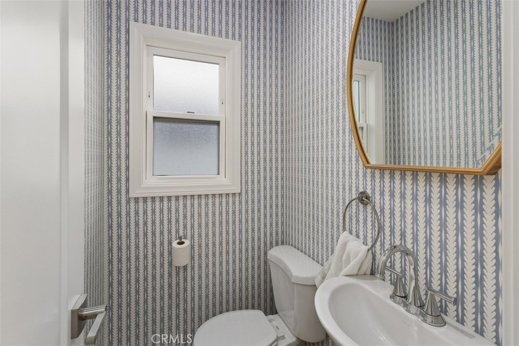 255 Colton Street Newport Beach, CA 92663 - Photo 11 of 24 a bathroom with a toilet and a sink