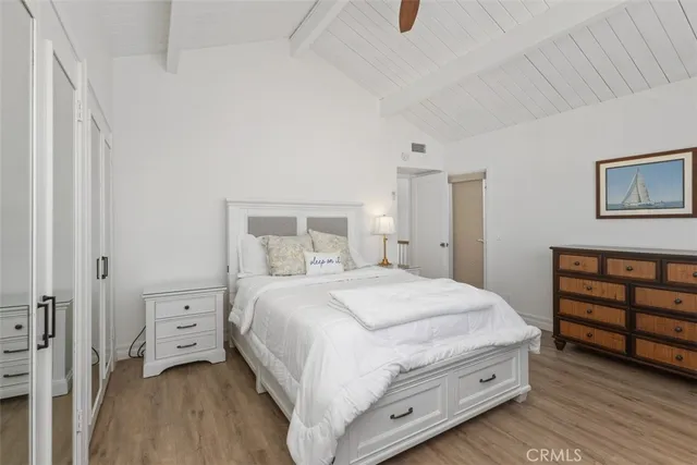 a bedroom with a bed and a closet