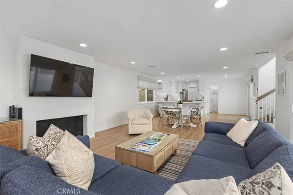 a living room with furniture fireplace and a flat screen tv