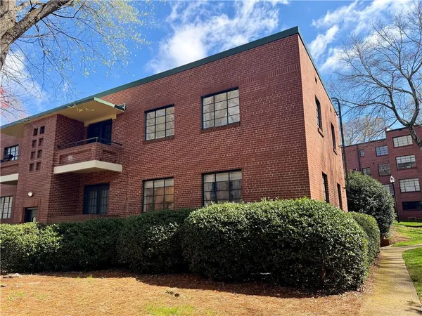 a brick building with a large windows